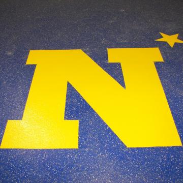 The United States Naval Academy Logo integrated within an epoxy floor.