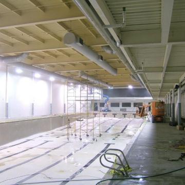 To stage the project, lifts and scaffolding are put in place.